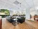 Open lounge area with comfortable leather sofas, dining table, and large windows offering plenty of natural light at 2479 Peachtree Ne Rd # 407, Atlanta, GA 30305