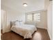 Well-lit bedroom with a comfortable bed, wood floors, and large windows offering natural light and city views at 2479 Peachtree Ne Rd # 407, Atlanta, GA 30305