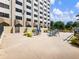 A wide outdoor patio with dining sets and planters at 2479 Peachtree Ne Rd # 407, Atlanta, GA 30305