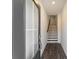 View of the home's entryway with hardwood floors and a staircase leading to the upper level at 3258 Durston Ct, Dacula, GA 30019