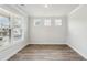 Bright bedroom with wood flooring and large windows offering ample natural light at 407 Westmarch Cir, Loganville, GA 30052