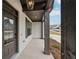 Front entrance with a dark door and covered porch at 407 Westmarch Cir, Loganville, GA 30052