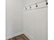Mudroom with coat hooks and decorative molding, providing a convenient entryway for families at 407 Westmarch Cir, Loganville, GA 30052