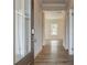 Inviting entryway with hardwood floors leading into the home at 414 Westmarch Cir, Loganville, GA 30052