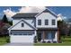 Charming two-story home with a two-car garage and inviting covered entryway at 414 Westmarch Cir, Loganville, GA 30052