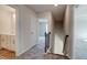 Upstairs hallway with views to bath, bedroom, and stairs at 414 Westmarch Cir, Loganville, GA 30052