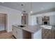 Gourmet kitchen with center island, granite countertops, and modern fixtures at 414 Westmarch Cir, Loganville, GA 30052