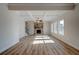Spacious living room featuring hardwood floors and a cozy stone fireplace at 414 Westmarch Cir, Loganville, GA 30052