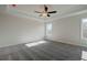 Bright main bedroom with tray ceiling and plush gray carpet at 414 Westmarch Cir, Loganville, GA 30052
