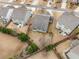 Aerial view of the property showing the backyard, deck, patio, and surrounding landscape at 505 Flyingbolt Run, Canton, GA 30115