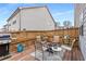 Back deck features seating around a fire pit, grill and a fenced yard at 505 Flyingbolt Run, Canton, GA 30115