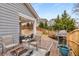 Relaxing back deck area with outdoor seating, a fire pit, a grill, and a fenced yard at 505 Flyingbolt Run, Canton, GA 30115
