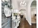 Inviting foyer with gleaming hardwood floors, elegant lighting, and neutral decor at 505 Flyingbolt Run, Canton, GA 30115