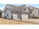 Spacious two-car garage with basketball hoop, and stone accents at 505 Flyingbolt Run, Canton, GA 30115