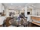 Bright, open kitchen featuring white cabinets, stainless steel appliances and view into the living room at 505 Flyingbolt Run, Canton, GA 30115