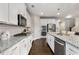 Spacious kitchen with granite countertops, stainless steel appliances, and white cabinetry at 505 Flyingbolt Run, Canton, GA 30115