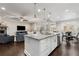 Bright, open kitchen with an island bar and sightlines to the dining and living areas at 505 Flyingbolt Run, Canton, GA 30115