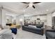 Spacious living room flows into a modern kitchen with white cabinets and stainless steel appliances at 505 Flyingbolt Run, Canton, GA 30115