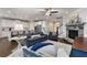 Inviting living room with a stone fireplace, open to the kitchen and dining areas at 505 Flyingbolt Run, Canton, GA 30115