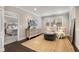 Sitting area features neutral decor, plantation shutters, and a view into an adjacent bedroom at 505 Flyingbolt Run, Canton, GA 30115