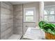 Modern bathroom with a walk-in shower and granite countertop at 2745 Fairlane Se Dr, Atlanta, GA 30354