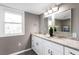 Updated bathroom with double vanity, granite countertops, and large mirror at 2745 Fairlane Se Dr, Atlanta, GA 30354