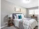 Serene bedroom with gray walls, plush bed, and stylish decor at 2745 Fairlane Se Dr, Atlanta, GA 30354