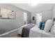 Spacious bedroom with gray walls, comfortable bed, and ample natural light at 2745 Fairlane Se Dr, Atlanta, GA 30354