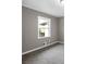 Bright bedroom featuring grey walls and new carpet at 2745 Fairlane Se Dr, Atlanta, GA 30354