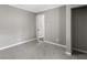 Spacious bedroom with grey walls and access to hallway at 2745 Fairlane Se Dr, Atlanta, GA 30354