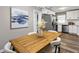 Light dining area with wooden table, chairs, and kitchen access at 2745 Fairlane Se Dr, Atlanta, GA 30354