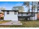 Ranch house with white brick exterior and large deck at 2745 Fairlane Se Dr, Atlanta, GA 30354