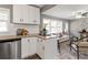 Modern kitchen with white cabinets, granite counters, and stainless steel appliances at 2745 Fairlane Se Dr, Atlanta, GA 30354