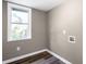 Laundry room with vinyl flooring and built-in shelving at 2745 Fairlane Se Dr, Atlanta, GA 30354
