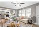 Bright living room with open layout, modern furniture, and kitchen view at 2745 Fairlane Se Dr, Atlanta, GA 30354