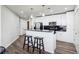 Modern kitchen with white cabinets and granite island at 860 Peachtree Ne St # 2618, Atlanta, GA 30308