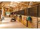 Spacious barn interior with stalls and workers at 4706 Powers Ferry Rd, Atlanta, GA 30327