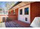 Back deck with access to backyard and brick exterior at 6531 Temple St, Lithia Springs, GA 30122