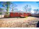 Brick home with a deck and expansive backyard at 6531 Temple St, Lithia Springs, GA 30122