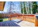 View from deck showcases fenced backyard and trees at 6531 Temple St, Lithia Springs, GA 30122