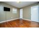 Hardwood floor bedroom with neutral walls and ample natural light at 6531 Temple St, Lithia Springs, GA 30122
