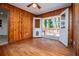 Dining room with wood paneling and access to deck at 6531 Temple St, Lithia Springs, GA 30122