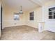 Bright dining area with updated flooring and a stylish light fixture at 6531 Temple St, Lithia Springs, GA 30122