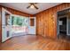 Dining room with wood paneling and access to deck at 6531 Temple St, Lithia Springs, GA 30122