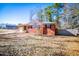 Brick ranch house with a fenced yard and attached garage at 6531 Temple St, Lithia Springs, GA 30122