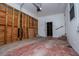 Unfinished garage with storage area and interior access at 6531 Temple St, Lithia Springs, GA 30122