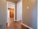 Hallway with hardwood floors and access to bedrooms at 6531 Temple St, Lithia Springs, GA 30122