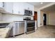 Updated kitchen features stainless steel appliances and granite countertops at 6531 Temple St, Lithia Springs, GA 30122
