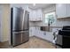 Modern kitchen, stainless steel appliances, white cabinets at 6531 Temple St, Lithia Springs, GA 30122