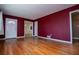 Bright living room featuring hardwood floors and access to other rooms at 6531 Temple St, Lithia Springs, GA 30122
